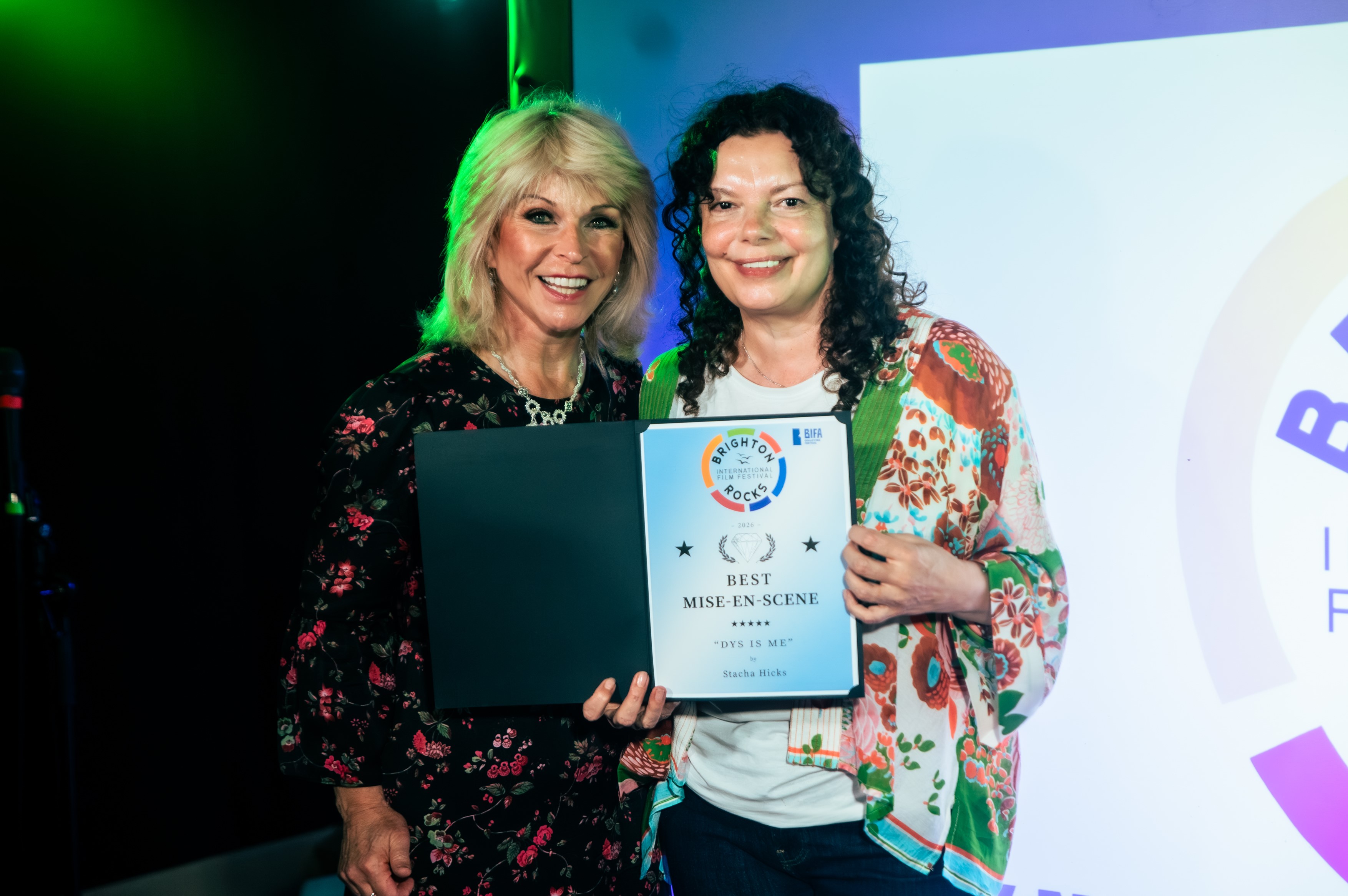 Writer/Director Stacha Hicks receiving her award from Toyah Willcox at Brighton Rocks Festival 